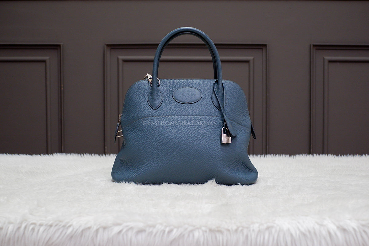 PRE-OWNED HERMES BOLIDE 31 BLUE SAPPHIRE STAMP O SQUARE
